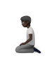 Person Kneeling: Dark Skin Tone